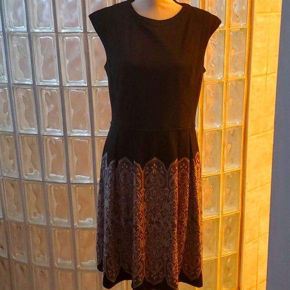 Maggy London Dresses & Skirts - A classic!  Dark grey dress w/unique design